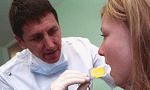Dentist helping a patient Dentist helping a patient